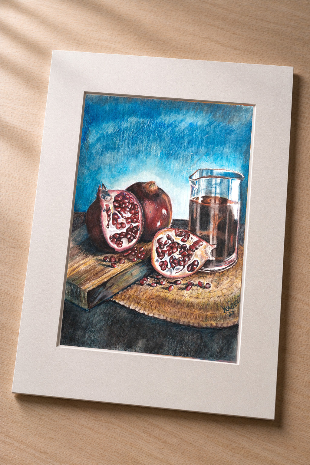 Pomegranate Still Life – matted fine art print of pomegranates and juice in colored pencil by Patti Vrabel
